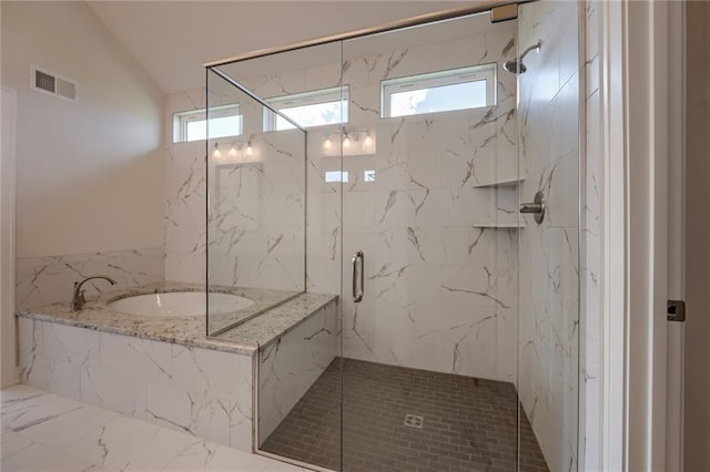 8216 NW 89th Ter, Kansas City, MO 64153 - bathroom with a garden tub, visible vents, a healthy amount of sunlight, lofted ceiling, and a marble finish shower