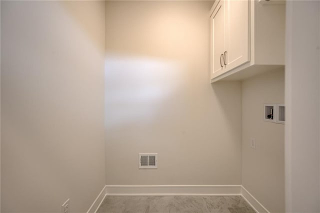 8216 NW 89th Ter, Kansas City, MO 64153 - washroom featuring visible vents, baseboards, hookup for a washing machine, and cabinet space