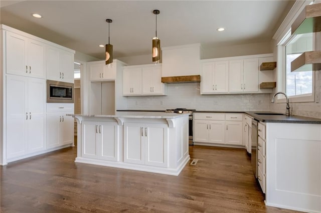 8216 NW 89th Ter, Kansas City, MO 64153 - kitchen with custom exhaust hood, open shelves, a sink, stainless steel appliances, and decorative backsplash