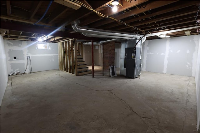 5606 N Indiana Ave, Kansas City, MO 64119 - basement featuring heating unit and stairway