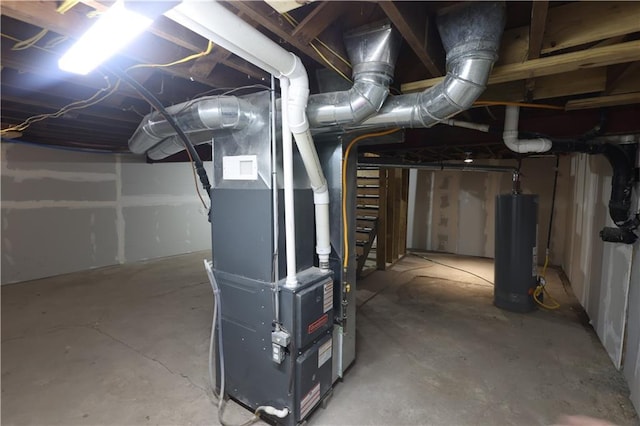 5606 N Indiana Ave, Kansas City, MO 64119 - unfinished basement featuring heating unit and gas water heater