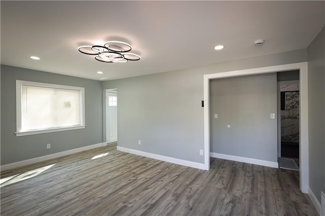 5606 N Indiana Ave, Kansas City, MO 64119 - unfurnished room featuring baseboards, recessed lighting, and wood finished floors
