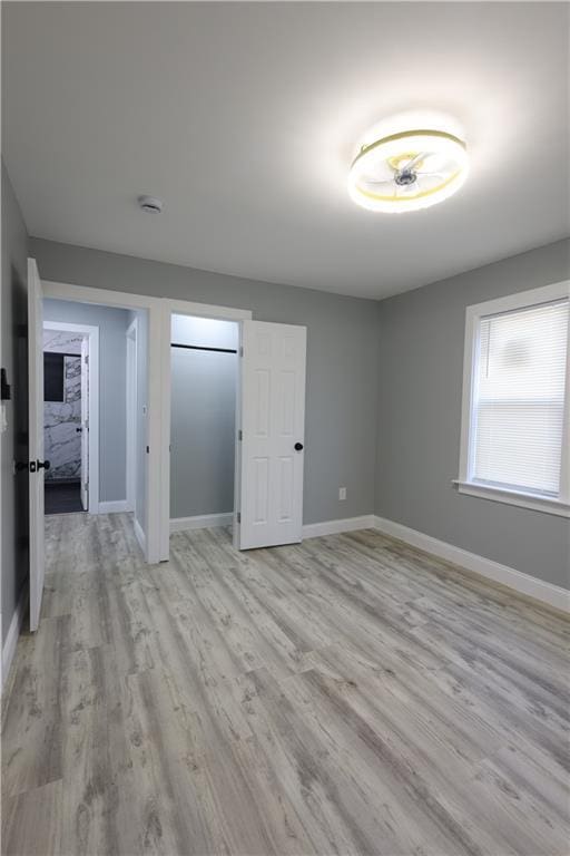 5606 N Indiana Ave, Kansas City, MO 64119 - interior space featuring baseboards and light wood-style flooring