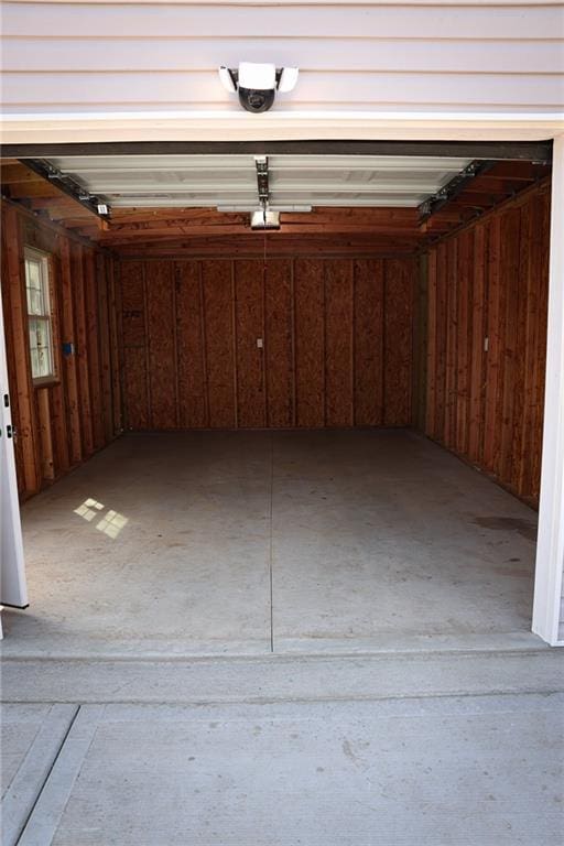5606 N Indiana Ave, Kansas City, MO 64119 - garage featuring a garage door opener