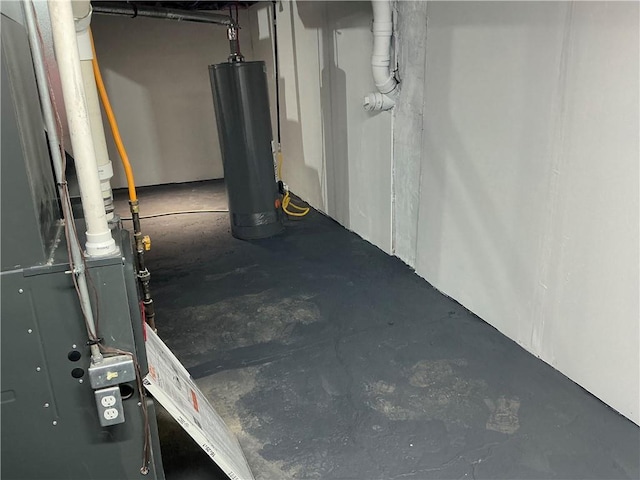5606 N Indiana Ave, Kansas City, MO 64119 - unfinished basement featuring water heater and heating unit