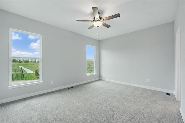 2433 NW Sunnyvale Ct, Blue Springs, MO 64015 - carpeted empty room with baseboards and ceiling fan