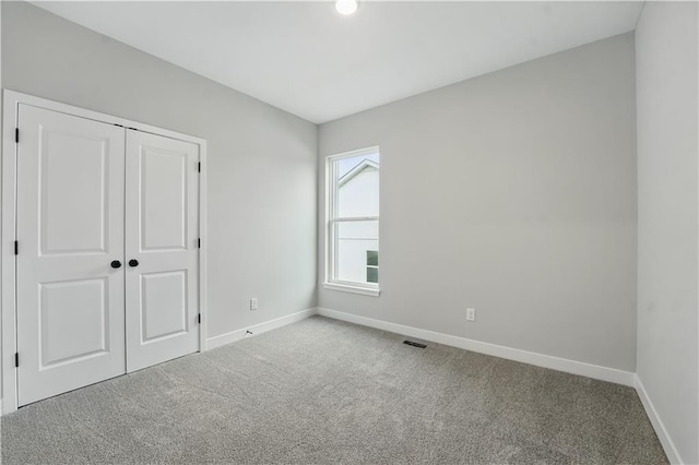 2433 NW Sunnyvale Ct, Blue Springs, MO 64015 - unfurnished bedroom featuring baseboards, carpet, and a closet