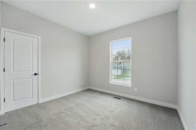 2433 NW Sunnyvale Ct, Blue Springs, MO 64015 - carpeted spare room with baseboards