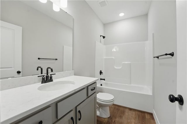 2433 NW Sunnyvale Ct, Blue Springs, MO 64015 - full bath with wood finished floors, toilet, vanity, and shower / tub combination