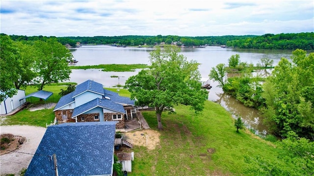 bird's eye view with a water view and a forest view