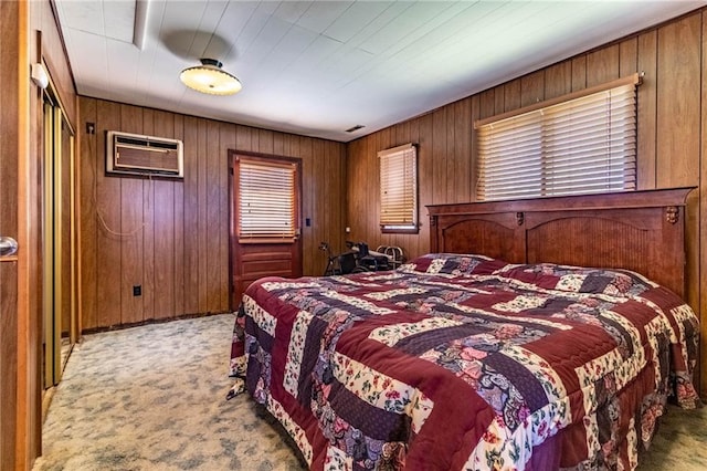 bedroom featuring a wall unit AC, carpet flooring, and wooden walls
