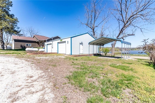 exterior space featuring a detached carport and driveway
