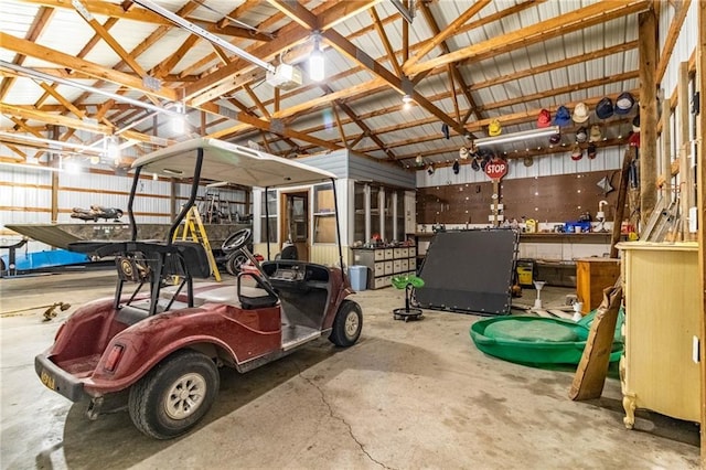 garage featuring a garage door opener and a workshop area