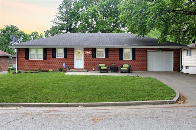 509 W 30th St, Higginsville, MO 64037 - single story home with a garage, concrete driveway, a front lawn, brick siding, and roof with shingles