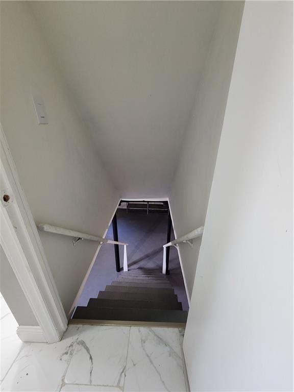 stairs with marble finish floor