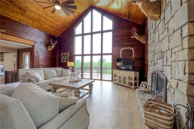 43 901st Rd, Clinton, MO 64735 - living area with wooden ceiling, high vaulted ceiling, ceiling fan, and wooden walls
