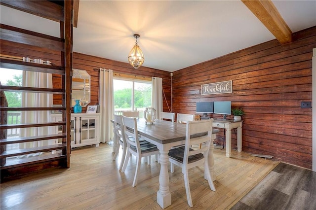 43 901st Rd, Clinton, MO 64735 - dining room with wooden walls, light wood-style floors, an inviting chandelier, and beam ceiling