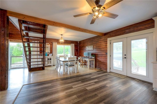 43 901st Rd, Clinton, MO 64735 - dining room with french doors, wood walls, beamed ceiling, ceiling fan, and wood finished floors
