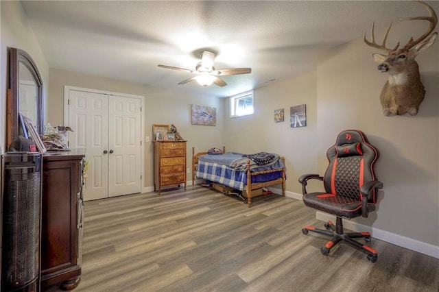 43 901st Rd, Clinton, MO 64735 - bedroom with a closet, baseboards, light wood finished floors, and ceiling fan
