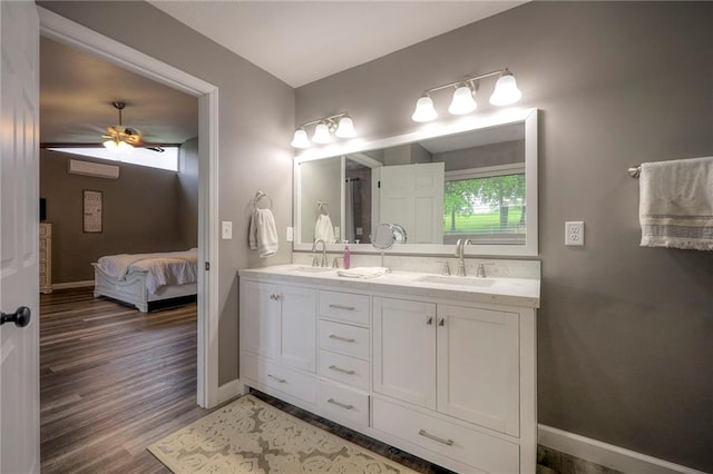 43 901st Rd, Clinton, MO 64735 - ensuite bathroom featuring double vanity, baseboards, a sink, and a ceiling fan