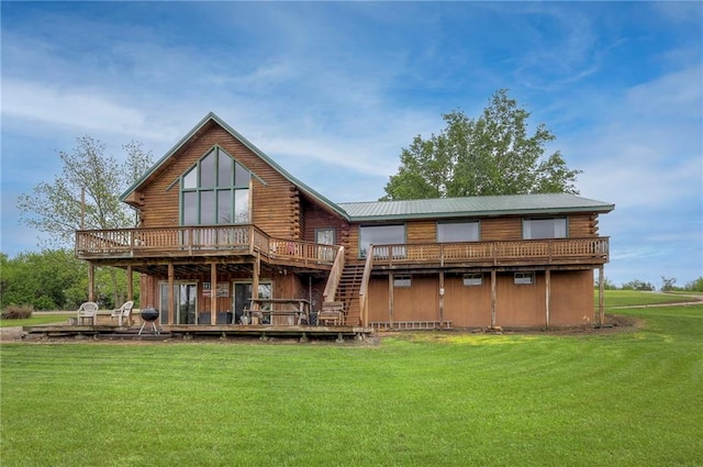 43 901st Rd, Clinton, MO 64735 - rear view of house featuring a wooden deck, a lawn, and log siding