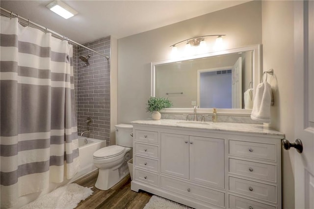 43 901st Rd, Clinton, MO 64735 - full bathroom with shower / bath combination with curtain, vanity, toilet, and wood finished floors
