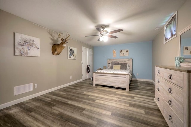 43 901st Rd, Clinton, MO 64735 - bedroom featuring dark wood-style flooring, baseboards, a ceiling fan, and visible vents