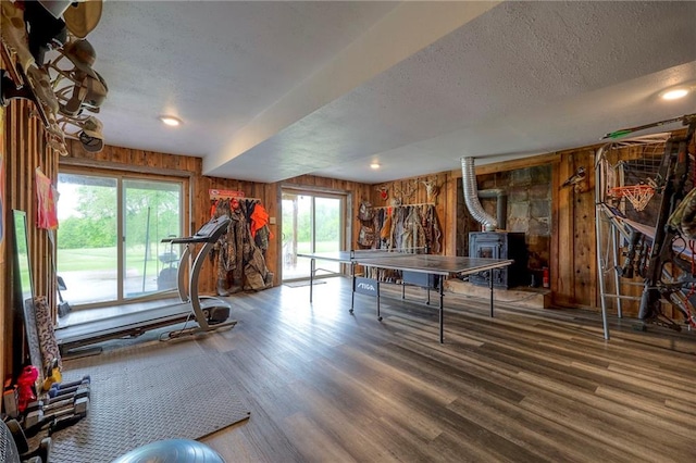 43 901st Rd, Clinton, MO 64735 - rec room with wood walls, a textured ceiling, and wood finished floors