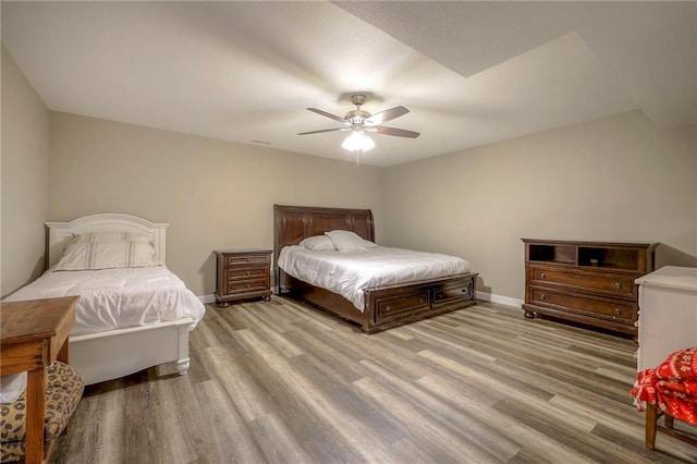 43 901st Rd, Clinton, MO 64735 - bedroom with baseboards, a ceiling fan, and wood finished floors