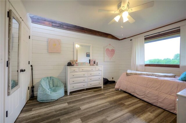 43 901st Rd, Clinton, MO 64735 - bedroom with wood walls, wood finished floors, ceiling fan, and vaulted ceiling