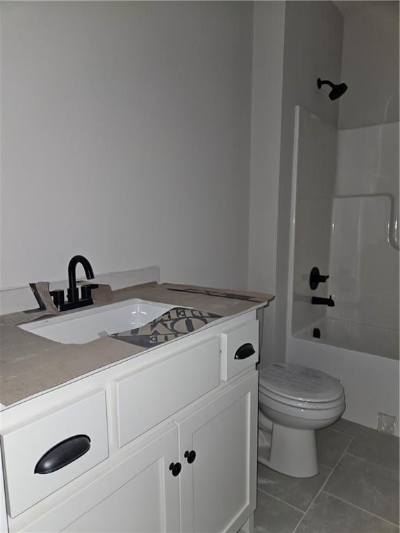 4967 146th St, Basehor, KS 66007 - bathroom with toilet, vanity, tile patterned flooring, and tub / shower combination