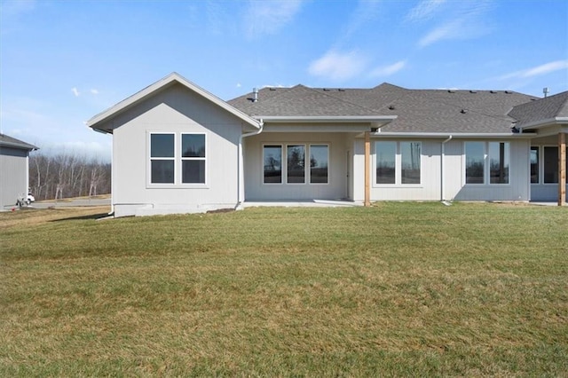 4967 146th St, Basehor, KS 66007 - rear view of property with a lawn and roof with shingles