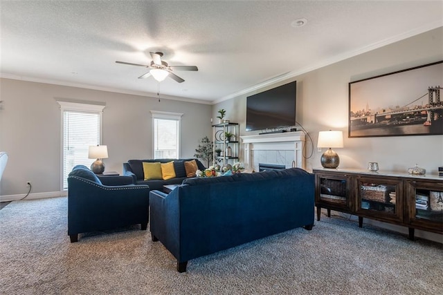 309 NE 102nd Ter, Kansas City, MO 64155 - carpeted living area featuring a fireplace, a ceiling fan, baseboards, and ornamental molding