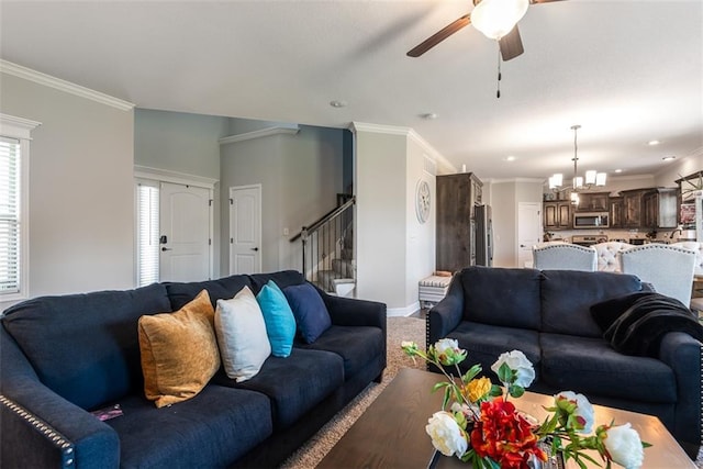 309 NE 102nd Ter, Kansas City, MO 64155 - living area with stairway, carpet, ornamental molding, baseboards, and ceiling fan with notable chandelier