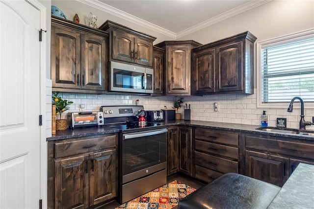309 NE 102nd Ter, Kansas City, MO 64155 - kitchen with backsplash, dark brown cabinets, stainless steel appliances, and a sink