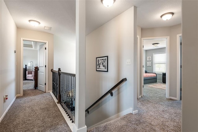 309 NE 102nd Ter, Kansas City, MO 64155 - corridor featuring carpet, baseboards, and an upstairs landing