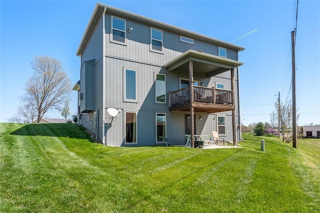 309 NE 102nd Ter, Kansas City, MO 64155 - rear view of property featuring a balcony and a yard
