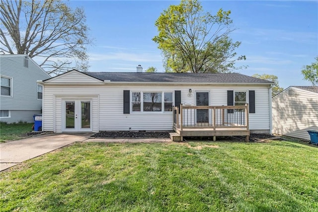 2411 NE 60th St, Gladstone, MO 64118 - rear view of house featuring a yard, a chimney, a deck, and french doors