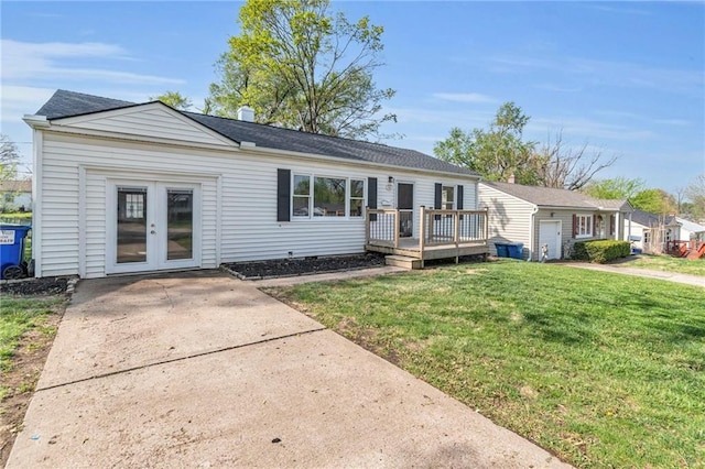 2411 NE 60th St, Gladstone, MO 64118 - rear view of property featuring french doors, a lawn, and a deck
