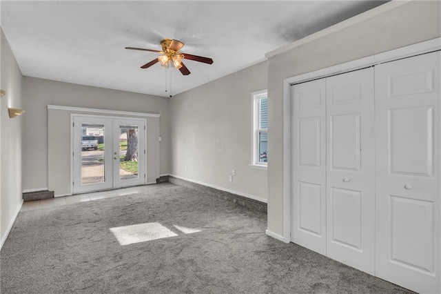 2411 NE 60th St, Gladstone, MO 64118 - unfurnished bedroom with carpet, a ceiling fan, french doors, baseboards, and access to outside