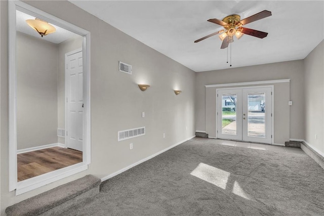2411 NE 60th St, Gladstone, MO 64118 - carpeted empty room with visible vents, a ceiling fan, baseboards, and french doors