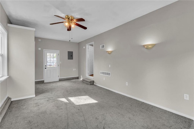 2411 NE 60th St, Gladstone, MO 64118 - carpeted empty room with electric panel, baseboards, visible vents, and ceiling fan