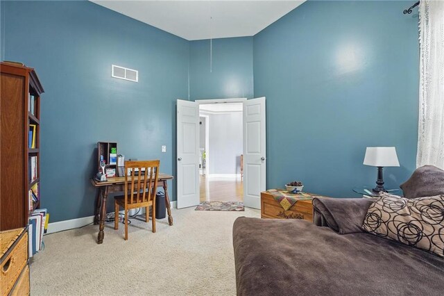 797 NW 1621st Rd, Bates City, MO 64011 - bedroom featuring light colored carpet, baseboards, visible vents, and a high ceiling