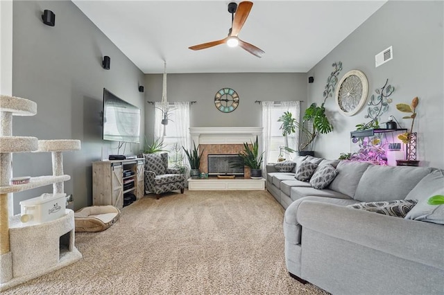 797 NW 1621st Rd, Bates City, MO 64011 - living area featuring carpet floors, a premium fireplace, ceiling fan, and visible vents
