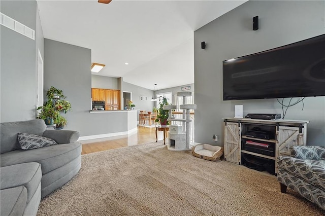 797 NW 1621st Rd, Bates City, MO 64011 - living area with visible vents, wood finished floors, baseboards, carpet, and vaulted ceiling
