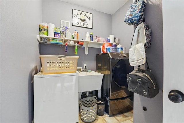 797 NW 1621st Rd, Bates City, MO 64011 - laundry room featuring laundry area, a sink, and washing machine and dryer