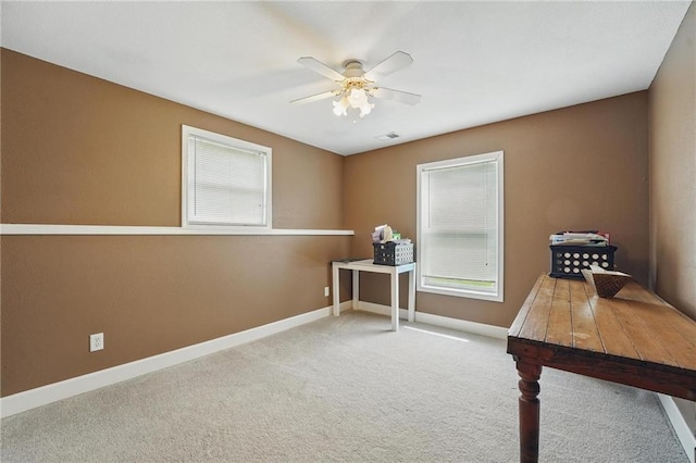 797 NW 1621st Rd, Bates City, MO 64011 - carpeted office space featuring a ceiling fan, baseboards, visible vents, and plenty of natural light
