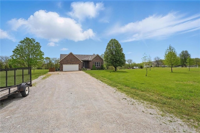 797 NW 1621st Rd, Bates City, MO 64011 - view of front of house featuring driveway, a front lawn, and a garage