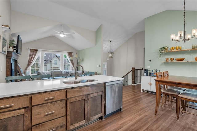 12631 Fountain Lake Cir, Grandview, MO 64030 - kitchen with dishwasher, lofted ceiling, dark wood-style flooring, a ceiling fan, and decorative light fixtures