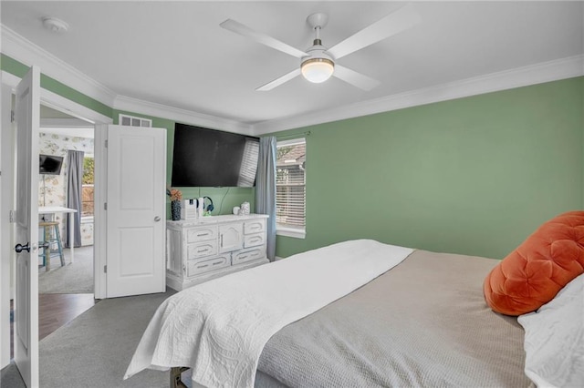 12631 Fountain Lake Cir, Grandview, MO 64030 - carpeted bedroom with ornamental molding and ceiling fan